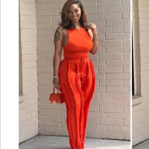 Beautiful red tassel trousers with matching red racer back bodysuit